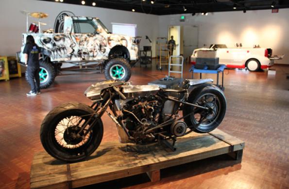 truck, car, and motorcycle in the exhibition