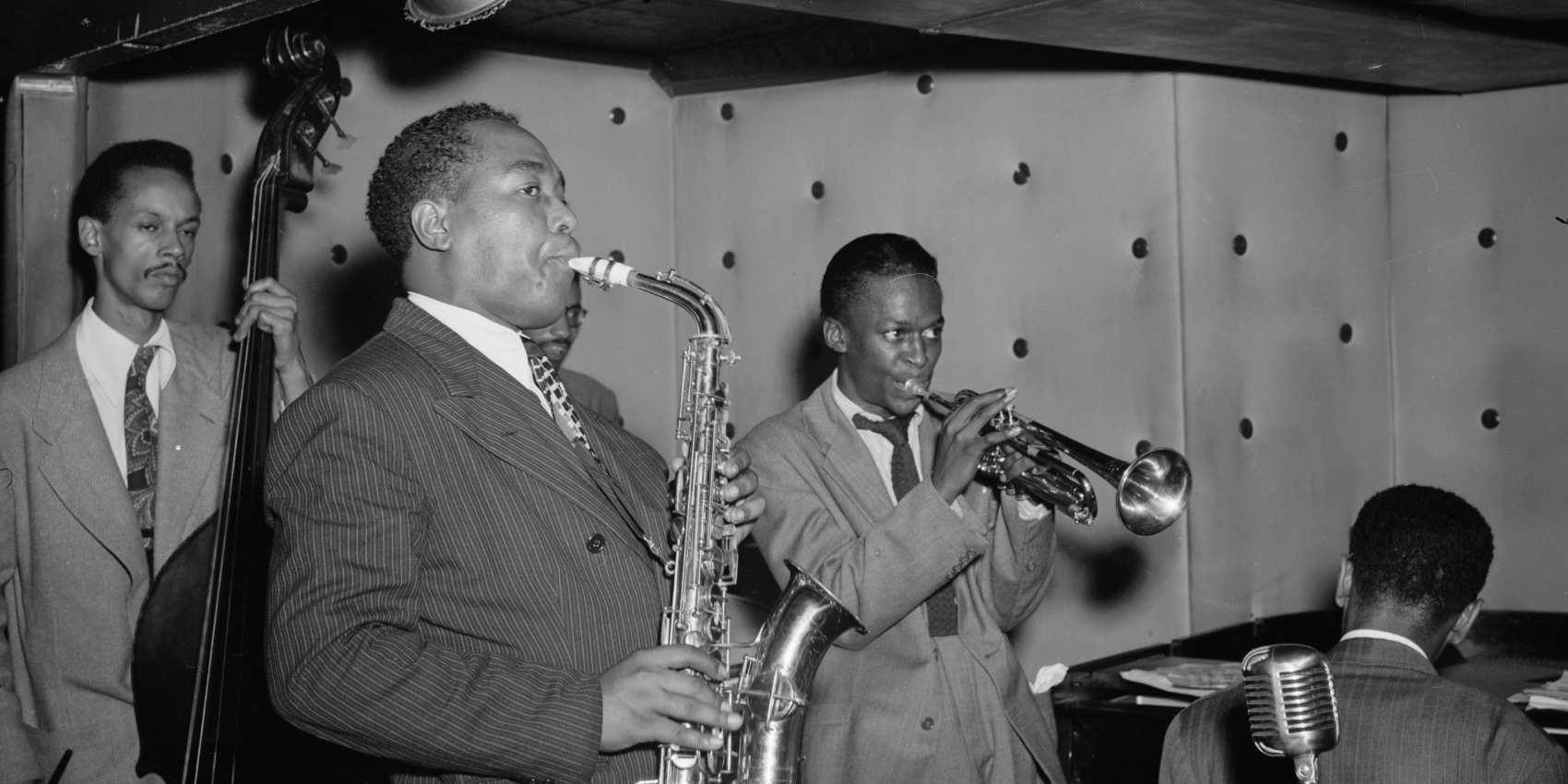 Jazz artists Charlie Parker and Miles Davis performing at the Finale Club.