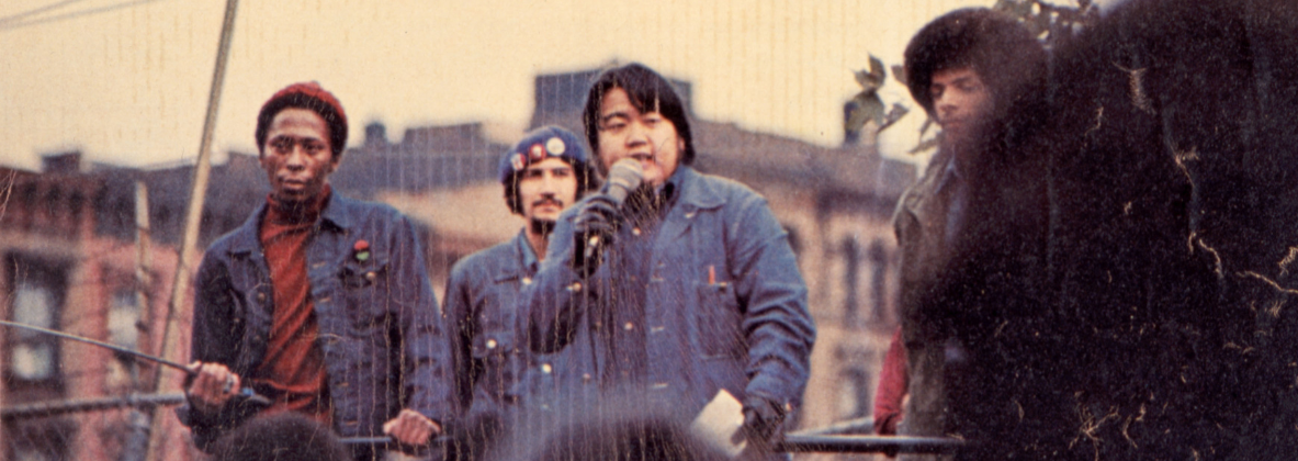 Activist Warren Furutani speaking in front of a crowd.