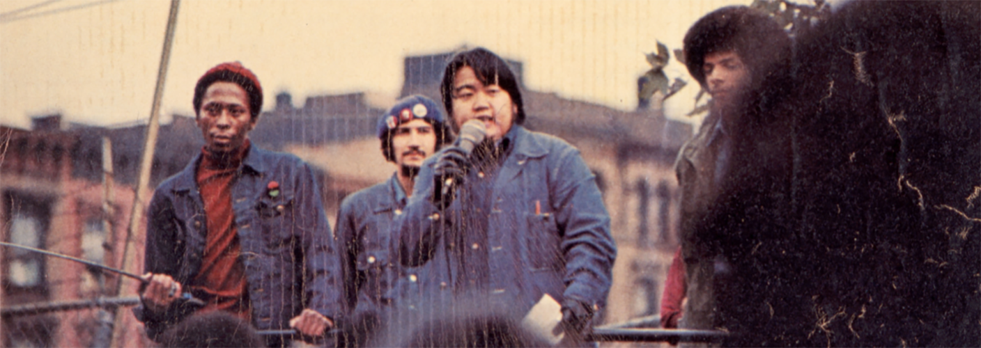 Activist Warren Furutani speaking in front of a crowd.