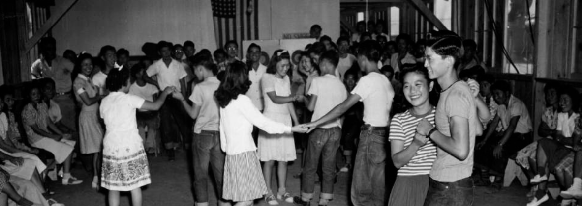 Black and white photograph of a school dance at Rohwer concentration camp (Gift of Mabel Rose Jamison (Jamie) Vogel).