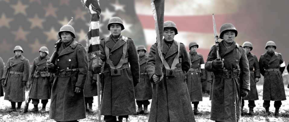 442 soldiers standing with American flag in background