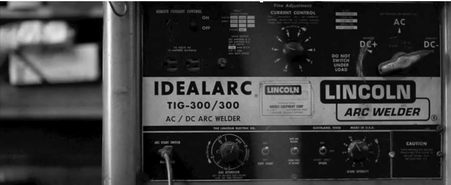 black and white photo of welder machine