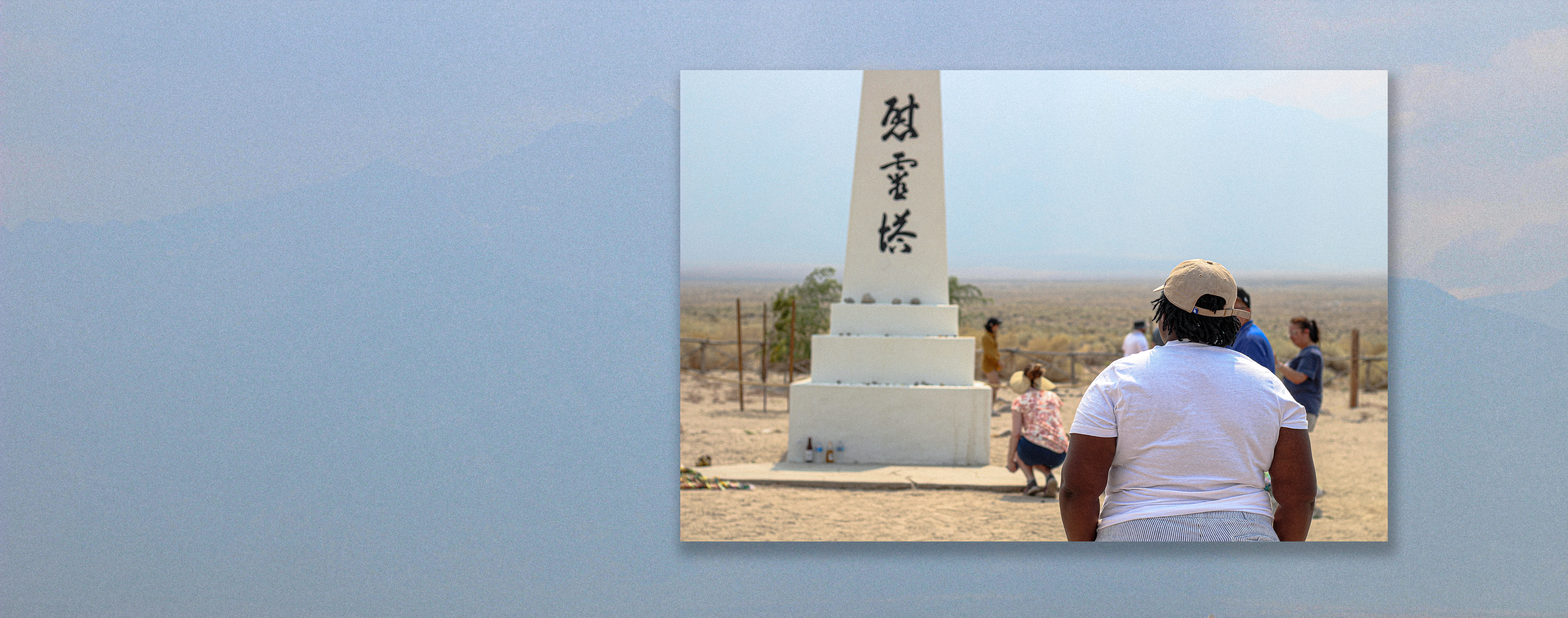 Woman looking at Manzanar monument