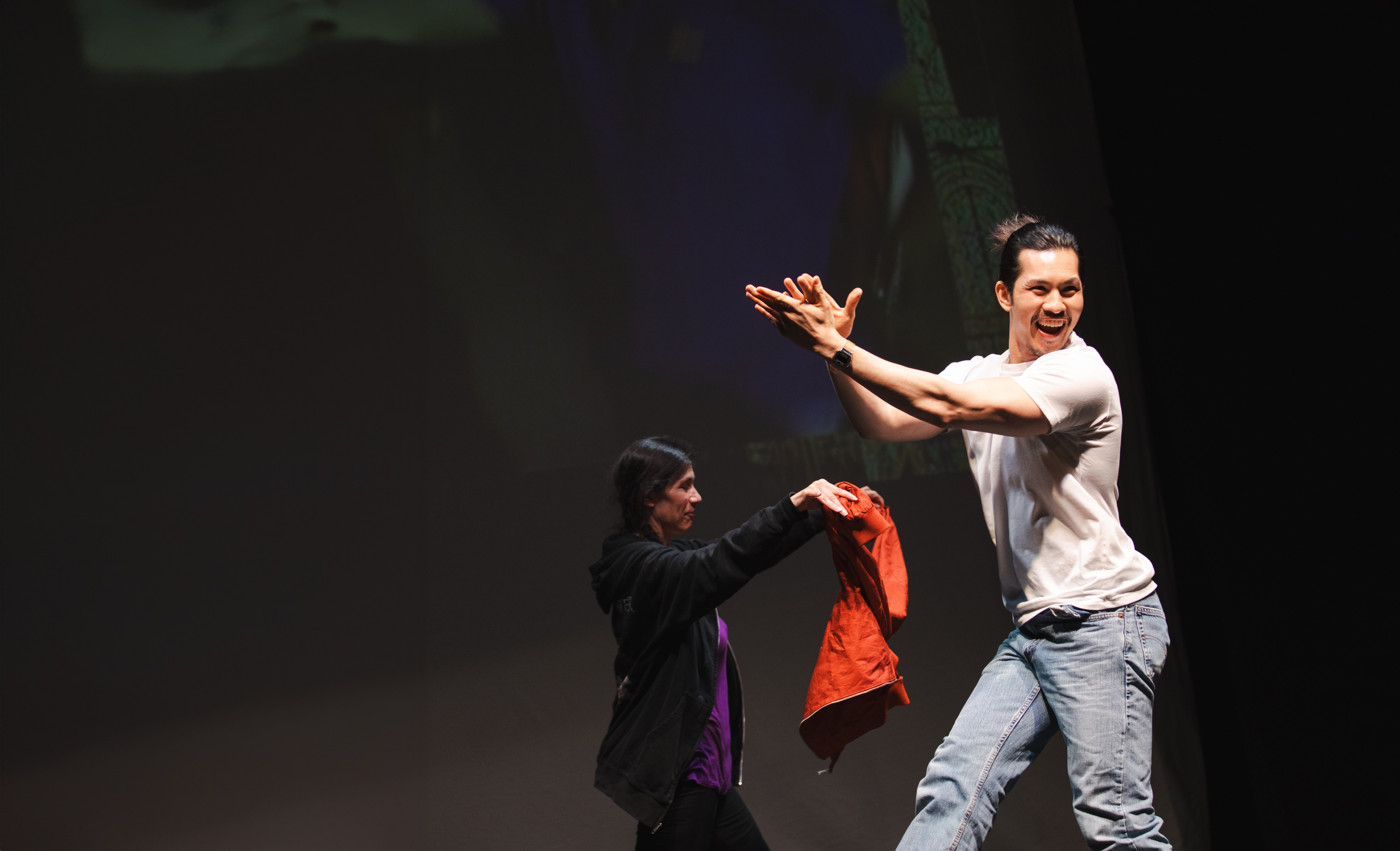 two performers on stage