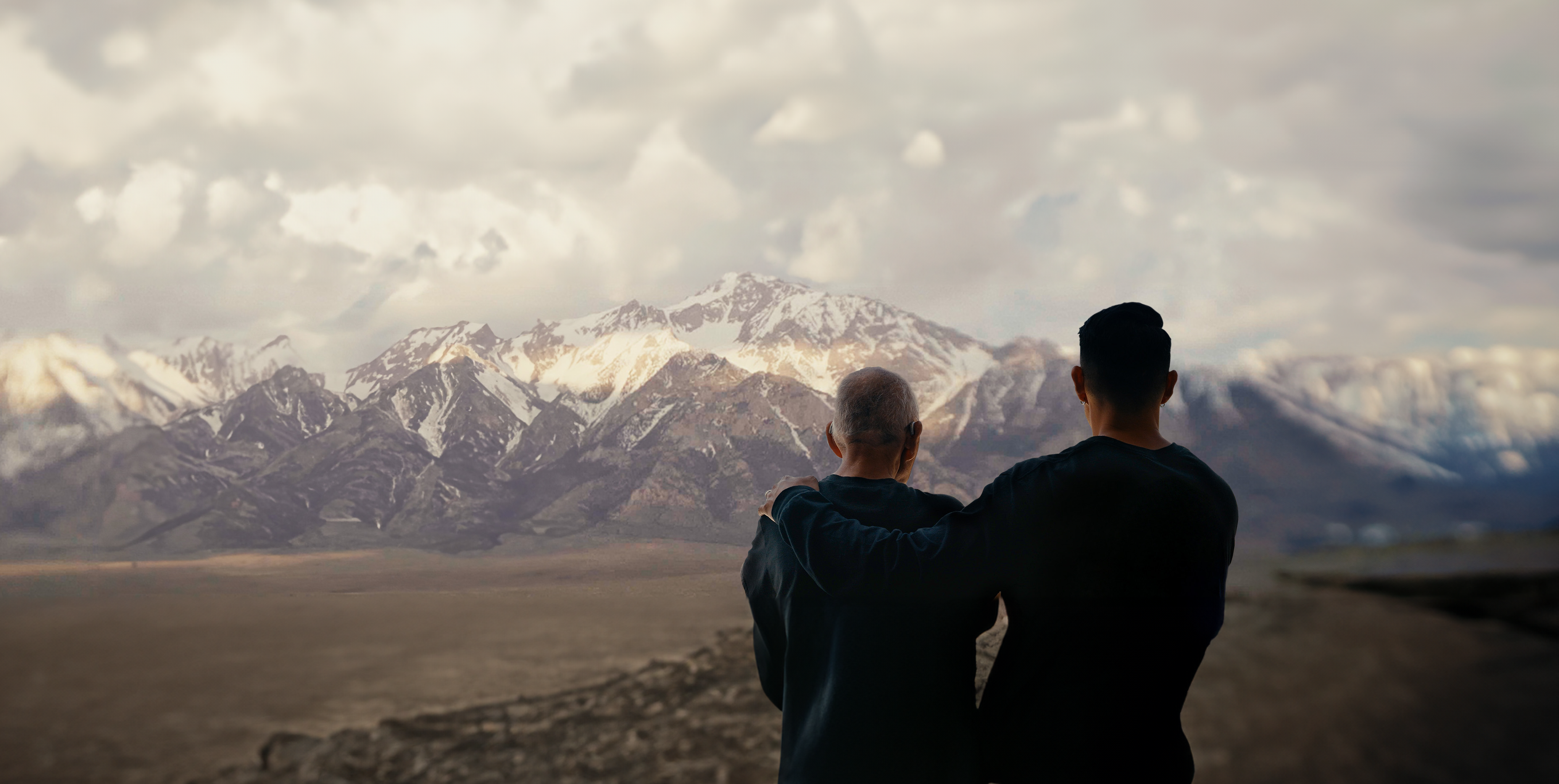 Father and son looking at the mountains behind Manzanar concentration camp