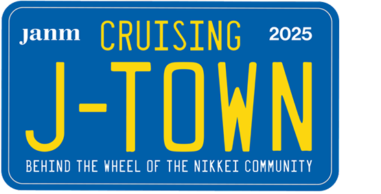 California looking Blue license plate that say JANM 2025 in corners and Cruising J-TOWN in big yellow letters and underneath it says Behind the wheel of the Nikkei Community