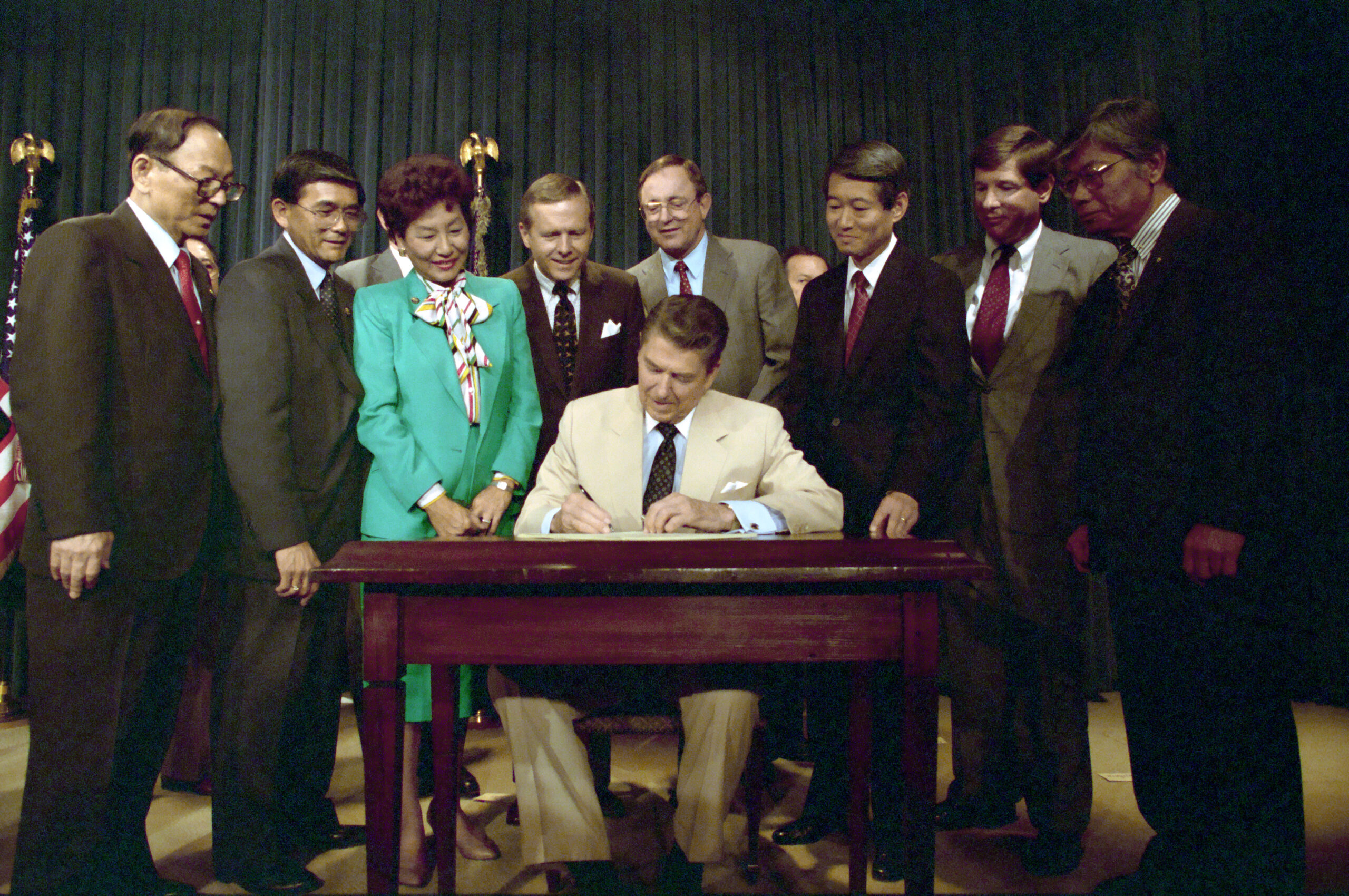 ronald reagan signs civil liberties act 1988