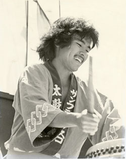 Black and white image of Kenny Endo playing the drums