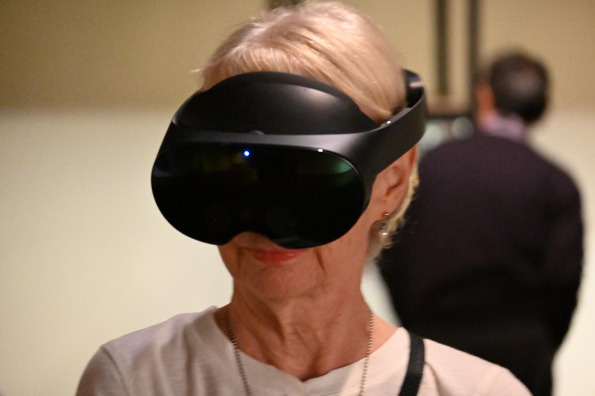 woman wearing VR headset in room