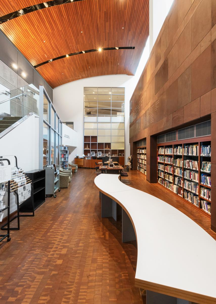 HNRC library with long curvy desk and wooden ceiling