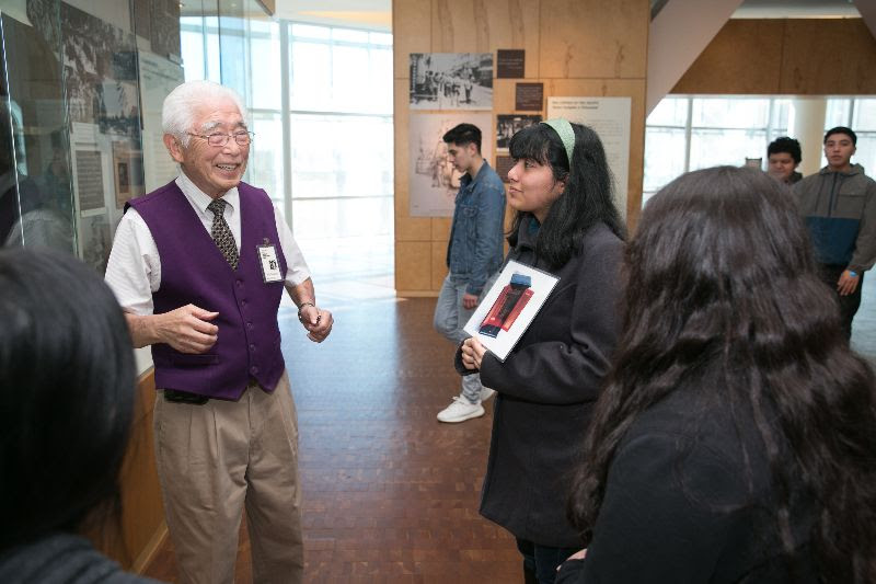 JANM docent Bill Shishima leading a school tour
