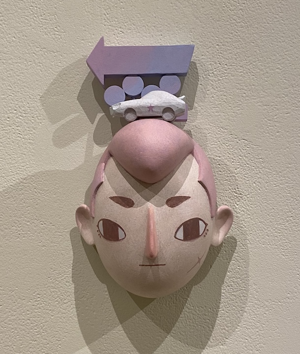 papermache head man with pompadour