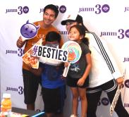 family taking their photos at photo booth
