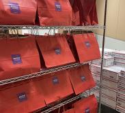 fukubukuro store red grab bag on the store shelf with online fukubukuro mailing boxes