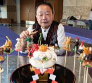 man making candy sculptures