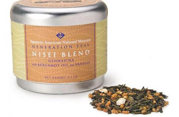 tin canister with orange and green label that says "Japanese American National Museum Generation Teas Nisei Blend" and a small scoop of tea leaves sitting next to it