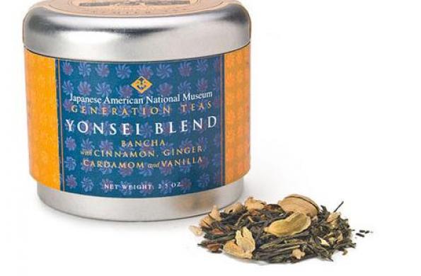 tin canister with blue and orange label that says "Japanese American National Museum Generation Teas Yonsei Blend" and a small scoop of tea leaves sitting next to it