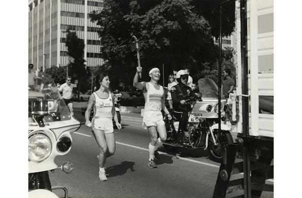 George Takei carries the Olympic torch through the streets of Los Angeles in the run up to the 1984 Olympic Games.