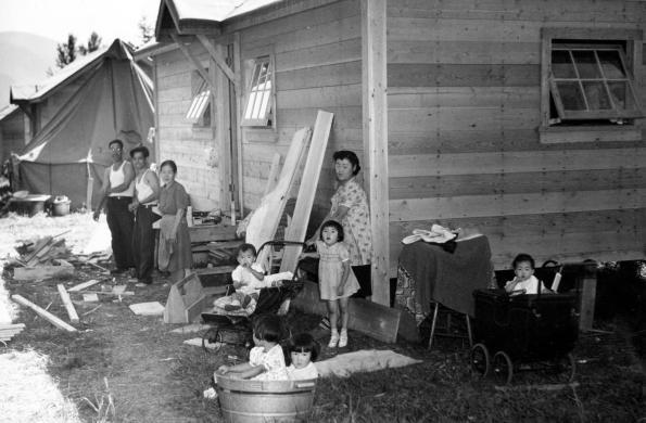 Family standing outside of a housing space