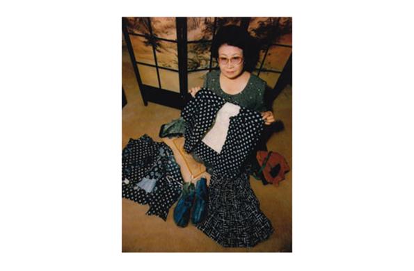 Barbara Kawakami shown from a bird's eye view holding with a typical plantation shirt for that time