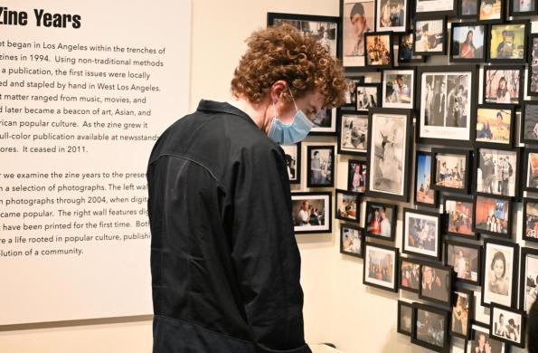 visitor looking at the giant robot zine years display