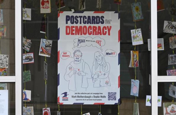 postacards and poster in window display