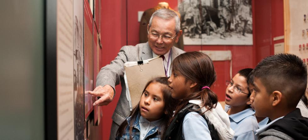 docent giving tour to school group