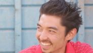 Travis Holcombe wearing red shirt smiling