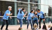 comedy group cold tofu perform skits outisde on the janm plaza for family festival