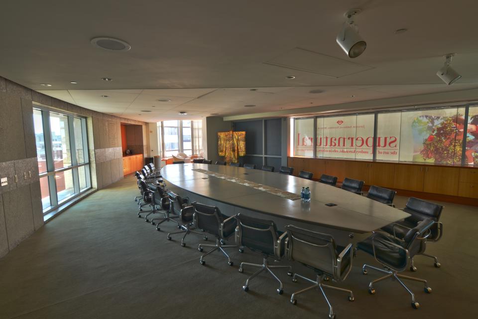 JANM Board Room with a long table in center of room with chairs around it with windows looking outside