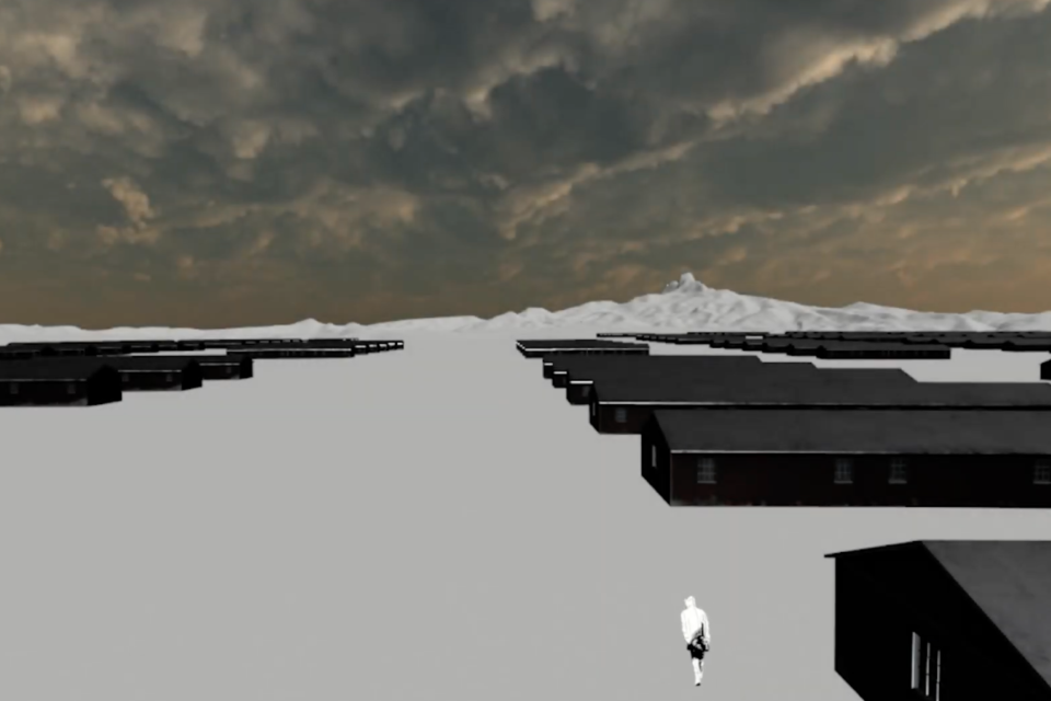 A screenshot of a VR illustration of an overhead shot of a WWII concentration camp with wooden barracks and a single figure walking in the bottom corner