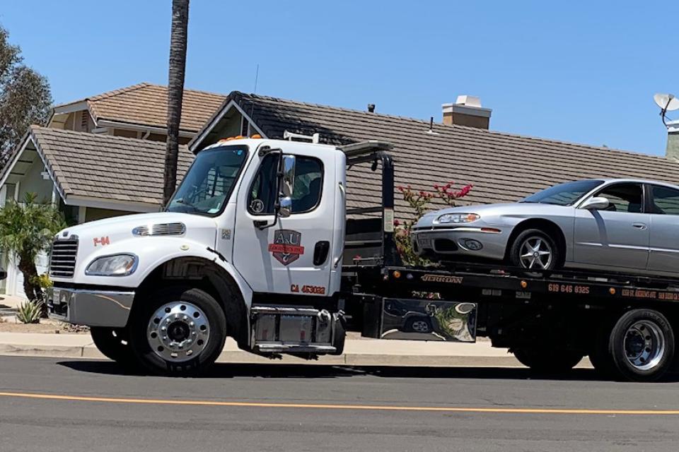 Tow truck hauling away a car