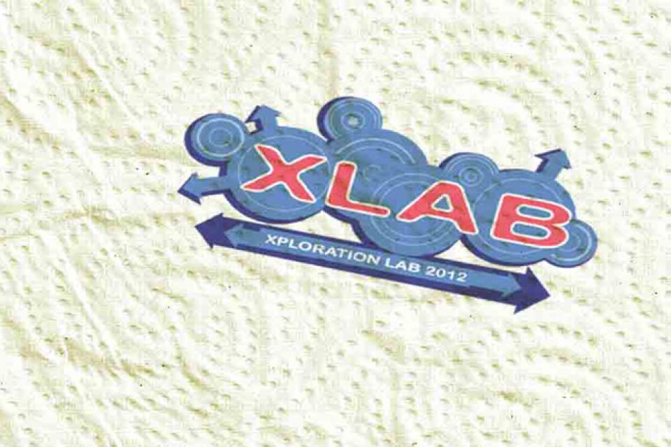 Paper towel with Xlab logo in upper right corner