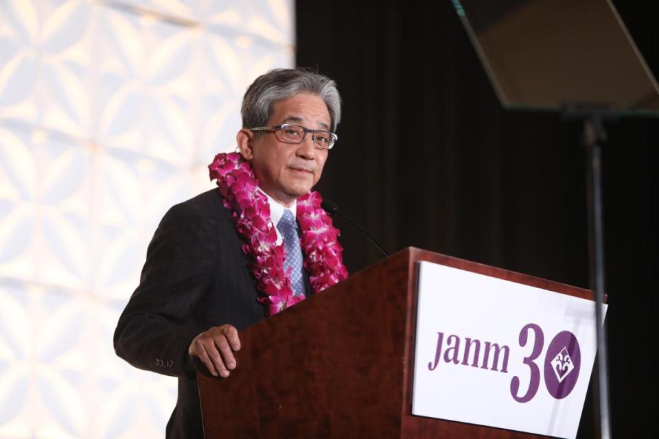 Kazuo “Kaz” Koshi speaking at podium