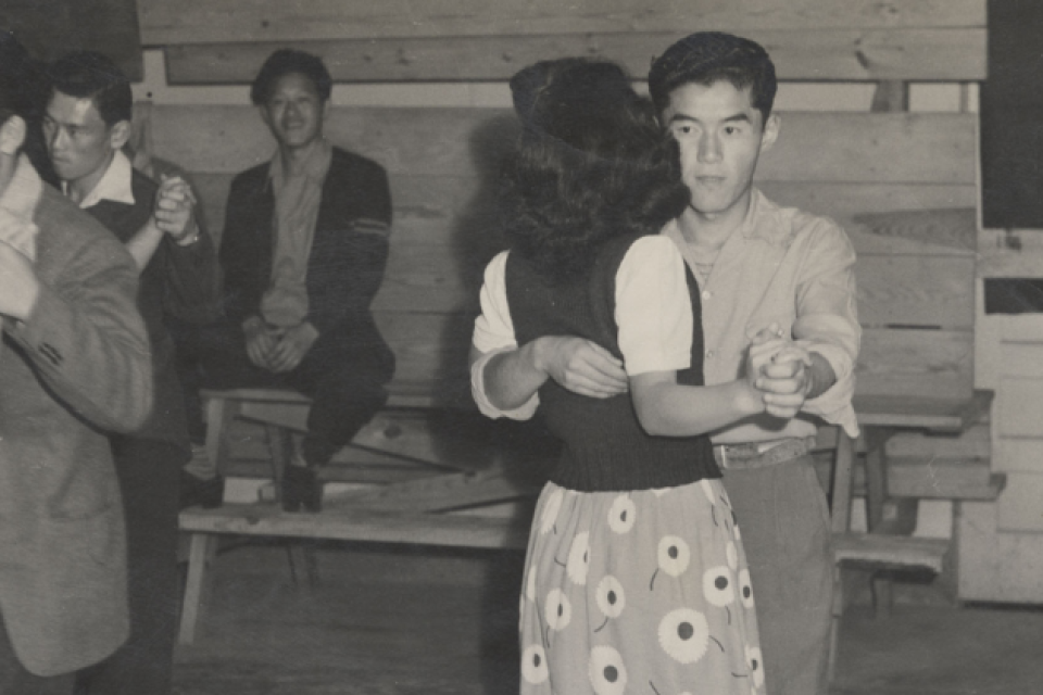 Black and white photograph of a school dance at Rohwer concentration camp (Gift of Mabel Rose Jamison (Jamie) Vogel).