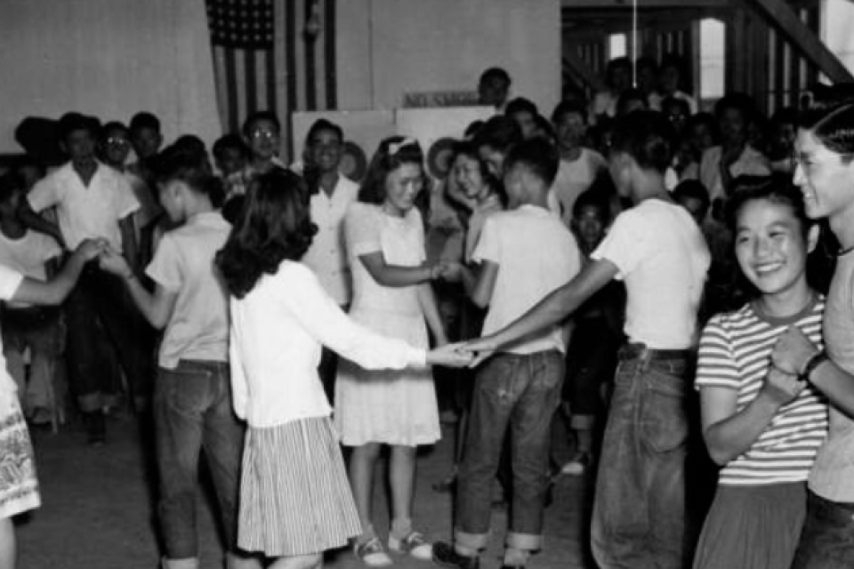 Black and white photograph of a school dance at Rohwer concentration camp (Gift of Mabel Rose Jamison (Jamie) Vogel).
