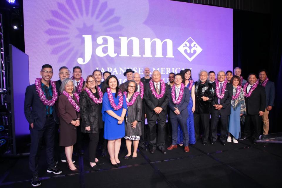 JANM 2023 Benefit speakers and performers pose for group photo on stage