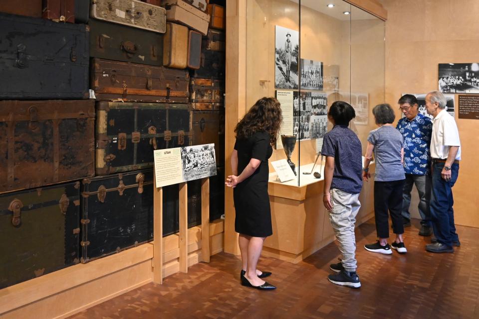 family looking at Common Ground exhibition
