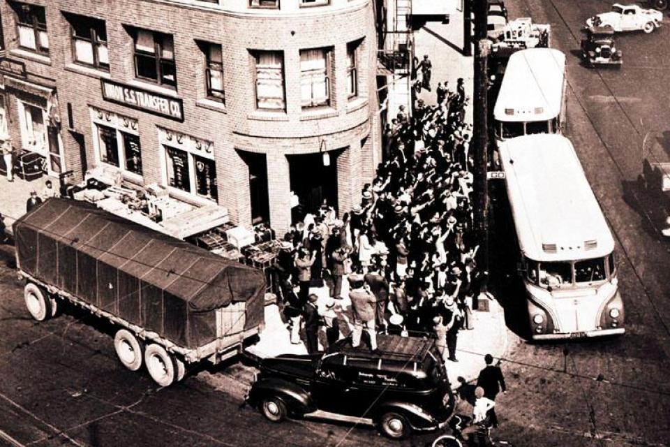 buddhist temple on 1st street with busses loading to take the japanese americans to the concentration camps