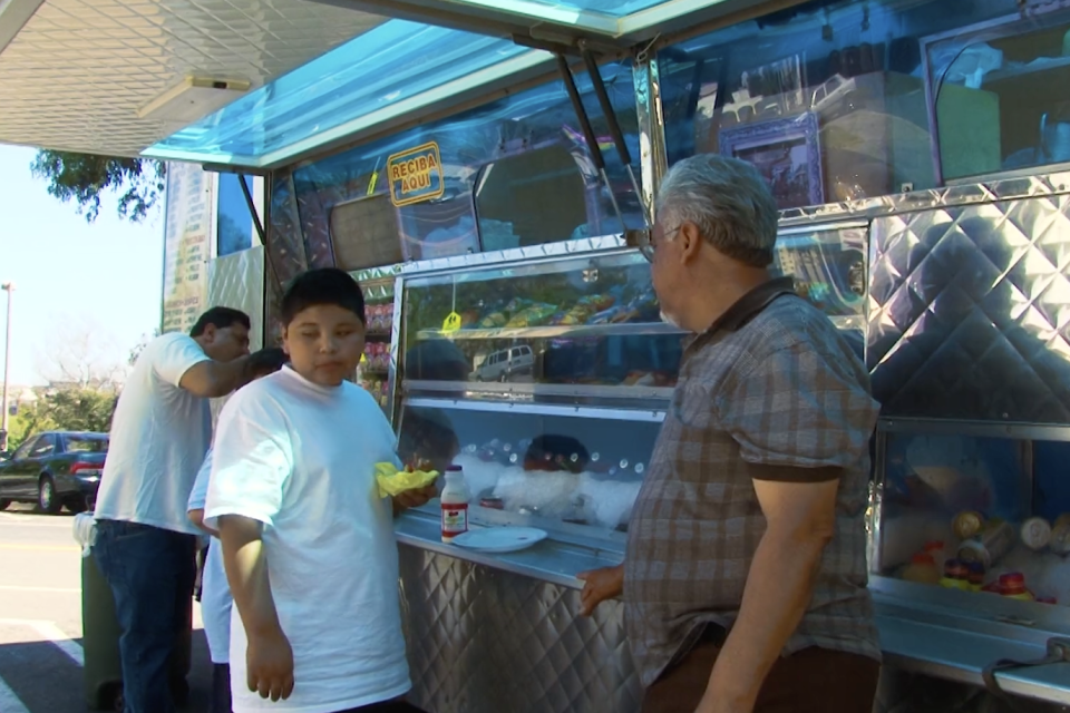 people eating at food truck