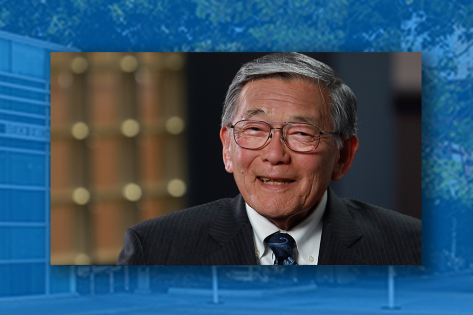 a portrait of norm mineta overlaid on top of a photo of the democracy center building that is tinted blue
