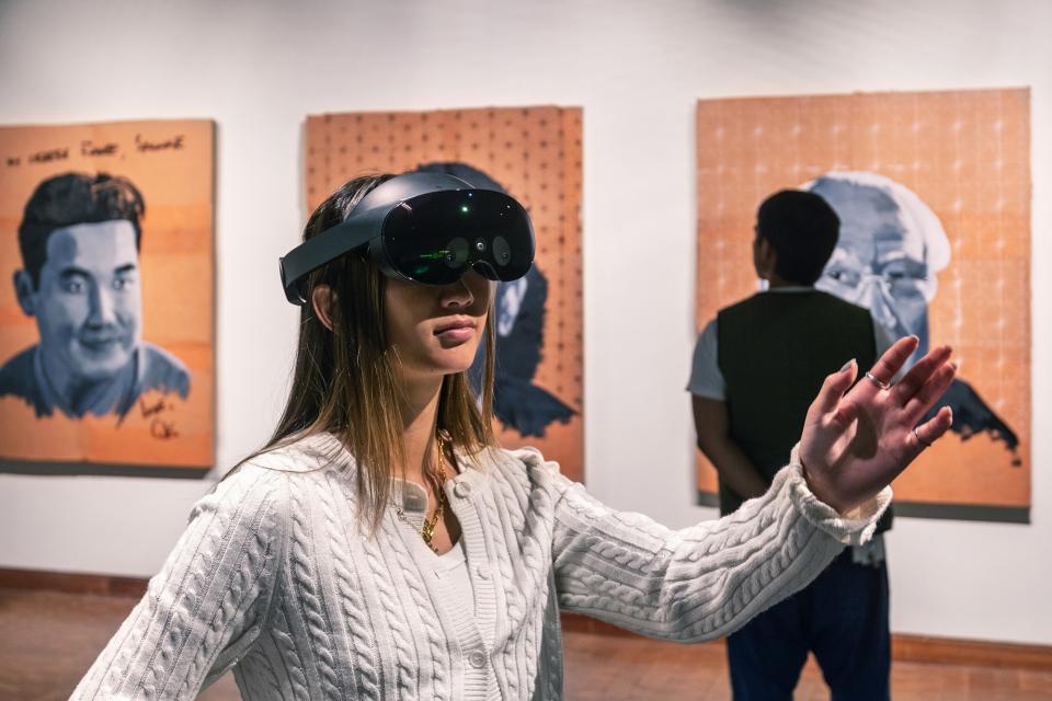 visitors experiencing vr exhibition, girl wearing vr googles