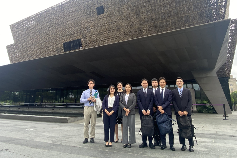 Group of young adults in front of building