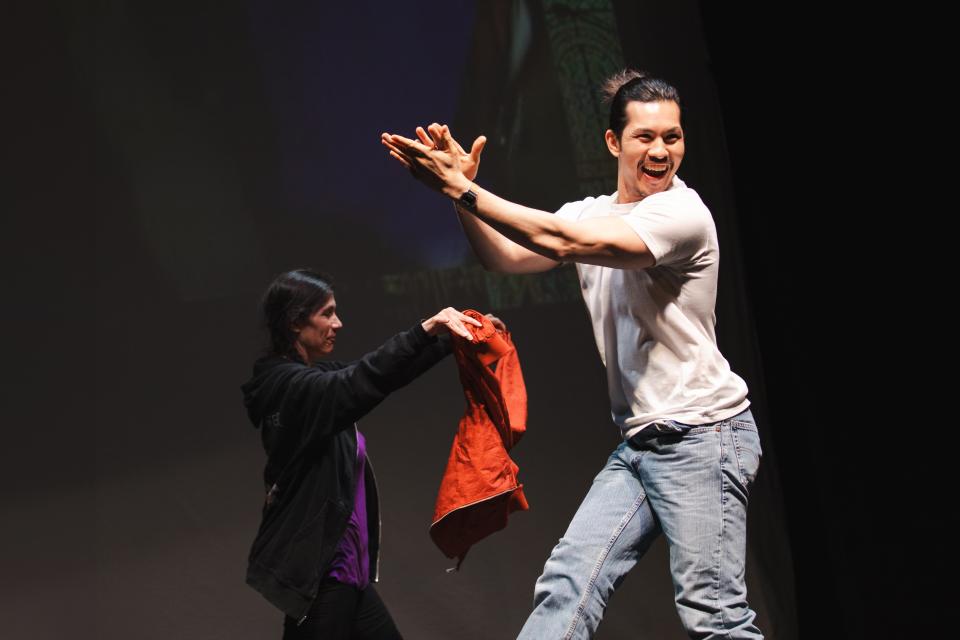 two performers on stage