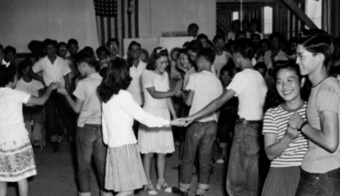Black and white photograph of a school dance at Rohwer concentration camp (Gift of Mabel Rose Jamison (Jamie) Vogel).